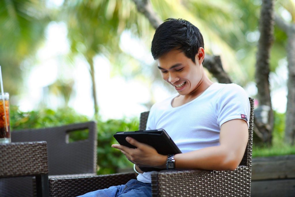 man playing with tab