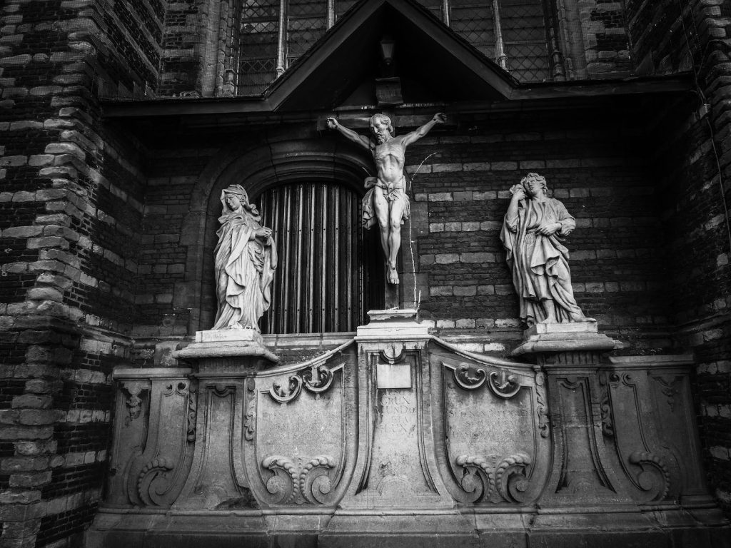angel statue in grayscale photography